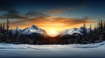 Winter landscape with snow covered mountains and trees at sunset photo