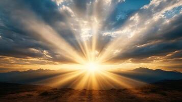 The sun shines over a mountain range in the sky photo