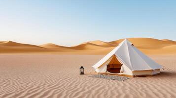 Minimalist tent setup in serene desert landscape, surrounded by golden dunes and clear blue sky photo