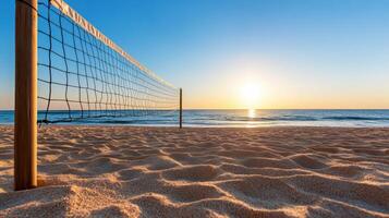 Tranquil beach scene featuring silhouetted volleyball net against stunning sunset. soft sand photo
