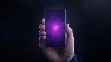 Hand holding smartphone displaying vibrant purple abstract design, symbolizing technology photo