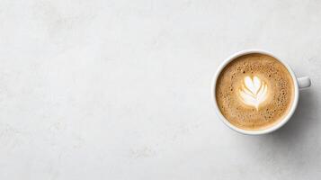 Creamy coffee with latte art on marble surface creates calming atmosphere photo