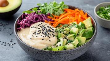 A bowl of vegetables and avocado with sesame seeds photo