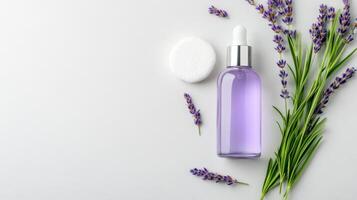 Lavender toner bottle with cotton pad and fresh lavender sprigs, perfect for skincare routines photo