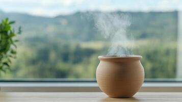 Clay pot with herbal steam rising, placed on wooden table, offers calming atmosphere photo