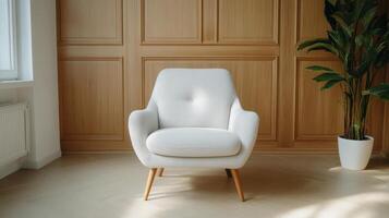 Cozy armchair with wooden paneling and indoor plant, creating serene atmosphere photo