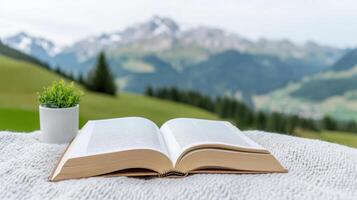 Open book rests cozy blanket, surrounded by serene alpine view, evoking sense of tranquility photo