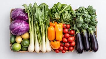 Fresh seasonal produce arranged by color, showcasing vibrant vegetables and greens photo