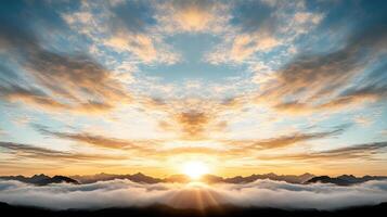 A sunset over the clouds with mountains in the background photo