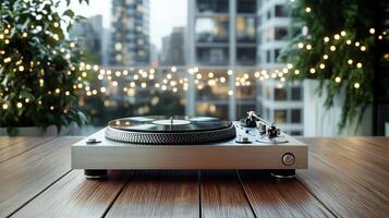 A turntable on a wooden table with lights in the background photo