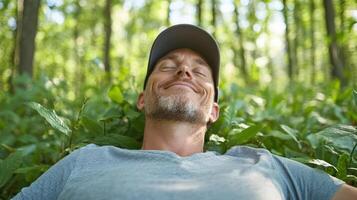 A man is smiling in the woods photo