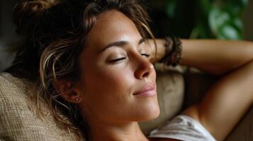 A woman is relaxing on a couch photo