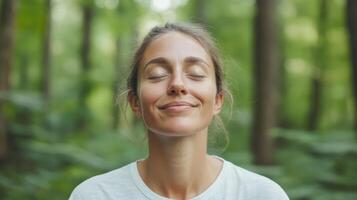 A woman is smiling in the forest photo