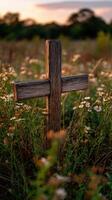 A wooden cross in a field of wildflowers photo