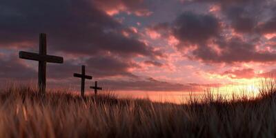 Crosses standing in a field during a vibrant sunset photo