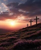 Sunset over a hillside with crosses and blooming flowers photo