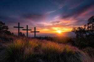 Sunrise over three crosses on a hilltop photo