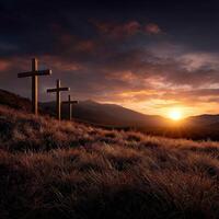 Three crosses on a hill in the sunset photo
