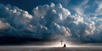 Reflective individual sitting near a cross under dramatic clouds photo