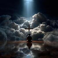 Man meditating in clouds with light and cross during twilight photo