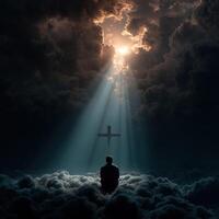 Person meditating in clouds under divine light and cross photo