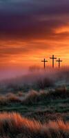 Serenity at dawn with crosses in the foggy landscape photo