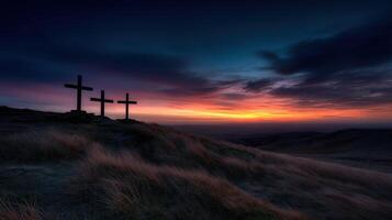 Sunset over three crosses on a hilltop photo