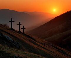 Sunset over hills with crosses in the foreground photo