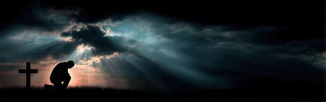 The cross and the man in the dark photo