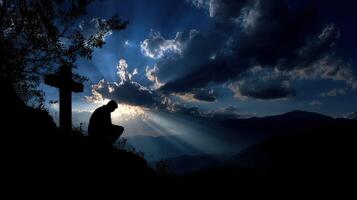 Solitary figure in contemplation against a dramatic sky at dusk photo