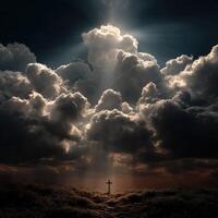 Cross illuminated by dramatic clouds at twilight photo