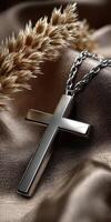 Elegant cross pendant resting on soft fabric photo
