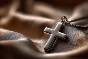 A cross pendant on a leather surface photo