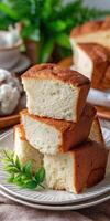Fluffy Japanese bread cake stacked on a plate with greenery photo