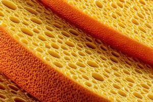 Close-up of textured yellow cheese slices with visible holes photo