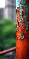 Weathered column reveals vibrant layers of paint in urban setting photo