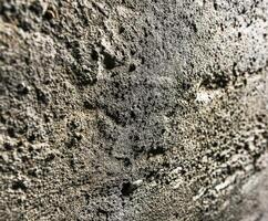 de cerca de texturizado hormigón pared con único patrones foto