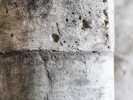 Close-up of textured concrete wall in urban setting photo