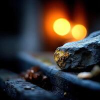 Warm glow from fire contrasts with rough stone surface photo
