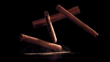Cinnamon sticks fall on the table. Filmed on a high-speed camera at 1000 fps. High quality FullHD footage video