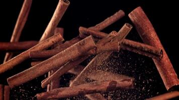 Cinnamon sticks fly up and down. Filmed on a high-speed camera at 1000 fps. High quality FullHD footage video