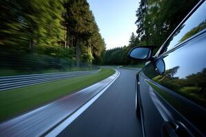 Scenic drive on winding road through forested landscape photo