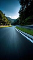 Curved road through forested hills on a sunny day photo
