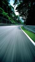 Racing along a winding road in a lush green environment photo