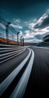 Racing cars speed around a curved track during twilight photo