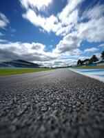 Race track view with dramatic clouds in clear sky photo