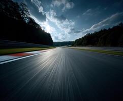 Race track curves under cloudy sky at sunset photo