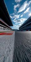 Wide angle view of racetrack under a blue sky in daytime photo