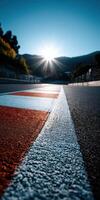 Sunset view over racetrack with colorful markings in foreground photo