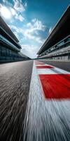 Racetrack view with vibrant lines and grandstands under blue sky photo